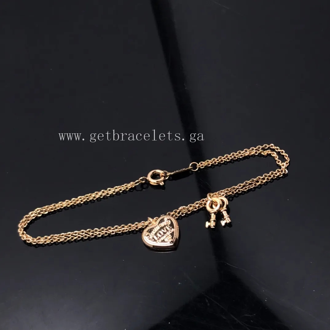 Return to Tiffany Love Heart Tag Key Bracelet in Silver/Rose Gold
