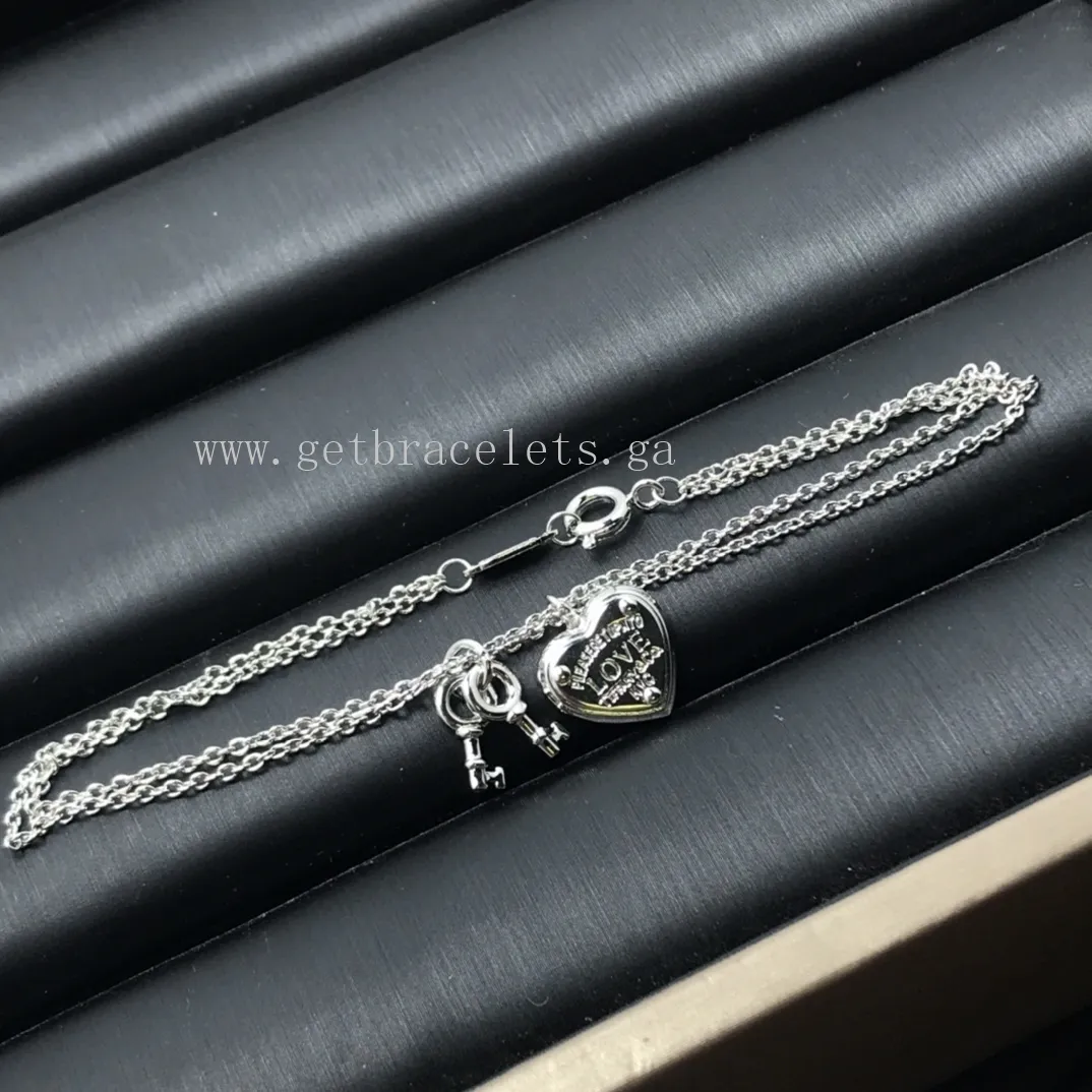 Return to Tiffany Love Heart Tag Key Bracelet in Silver/Rose Gold