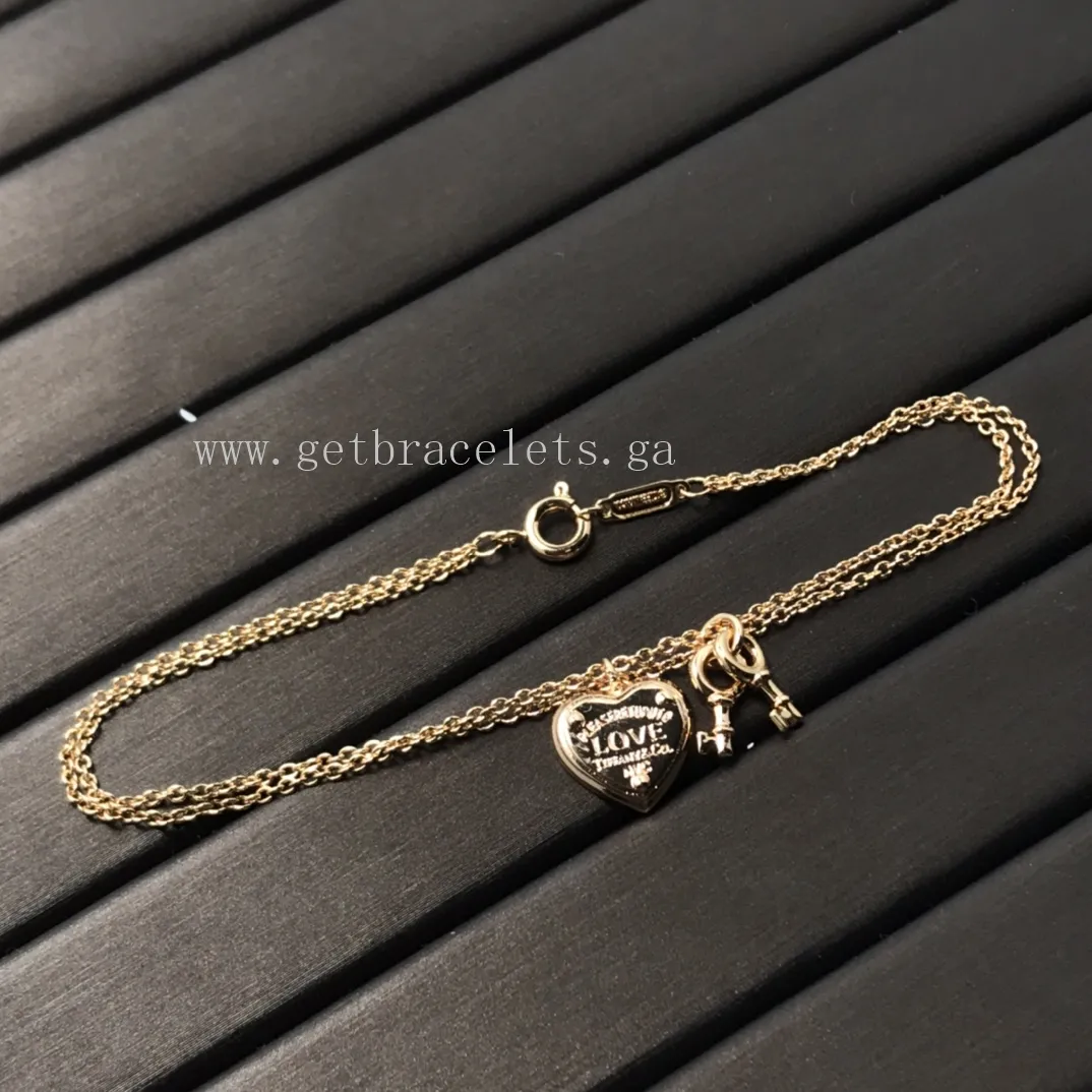 Return to Tiffany Love Heart Tag Key Bracelet in Silver/Rose Gold
