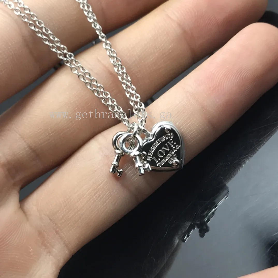 Return to Tiffany Love Heart Tag Key Bracelet in Silver/Rose Gold