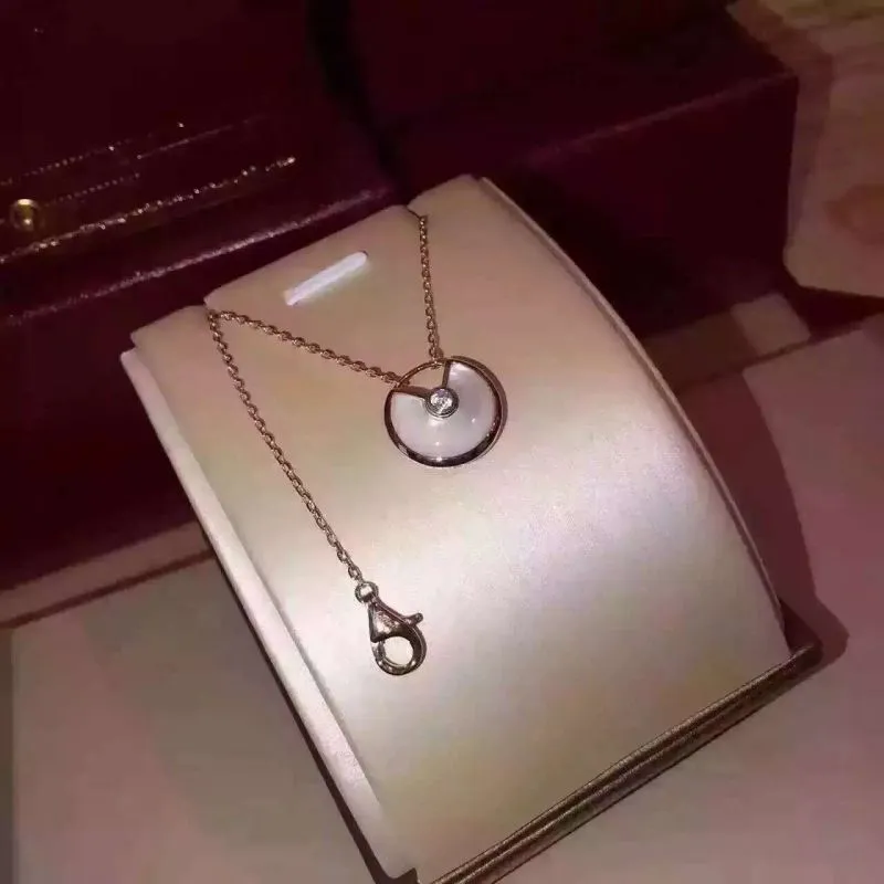 Amulette de Cartier White Mother-of-Pearl Diamond Necklack in Yellow Gold, White Gold and Pink Gold